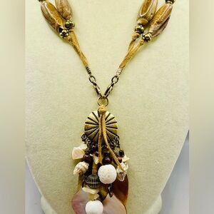 Large seashell,abalone and brass tone pendant on a double suede seashell chain